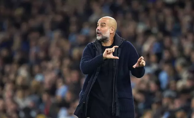 Manchester City's head coach Pep Guardiola reacts during the English Premier League soccer match between Manchester City and Manchester United at the Etihad Stadium in Manchester, Sunday, Dec. 15, 2024. (AP Photo/Dave Thompson)