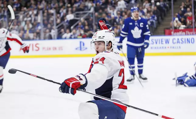 Washington Capitals center Connor McMichael (24) celebrates after his goal against the Toronto Maple Leafs during third-period NHL hockey game action in Toronto, Friday, Dec. 6, 2024. (Cole Burston/The Canadian Press via AP)