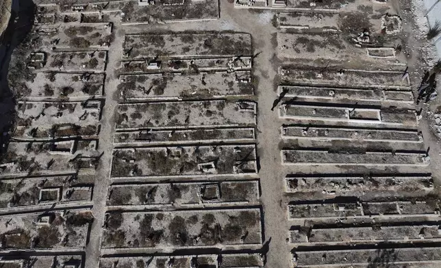 An arial view shows a mass grave where are buried those who were killed by the sarin struck during a 2013 chemical weapons attack that was blamed on then President Bashar Assad's forces, in Zamalka neighbourhood, on the outskirts of Damascus, Syria, Wednesday, Dec. 25, 2024. (AP Photo/Hussein Malla)