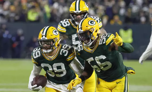 Green Bay Packers safety Zayne Anderson (39) celebrates his interception during the second half of an NFL football game against the New Orleans Saints, Monday, Dec. 23, 2024, in Green Bay, Wis. (AP Photo/Mike Roemer)