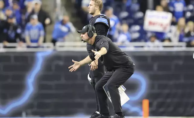 Detroit Lions head coach Dan Campbell, bottom, reacts next to quarterback Jared Goff during the second half of an NFL football game against the Buffalo Bills, Sunday, Dec. 15, 2024, in Detroit. (AP Photo/Rey Del Rio)