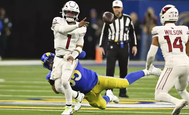 Arizona Cardinals quarterback Kyler Murray (1) throws under pressure from Los Angeles Rams defensive tackle Braden Fiske (55) during the second half of an NFL football game Saturday, Dec. 28, 2024, in Inglewood, Calif. (AP Photo/Alex Gallardo)