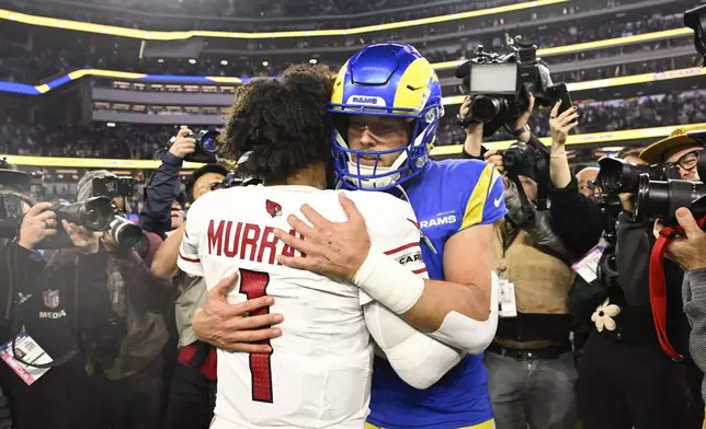 Arizona Cardinals quarterback Kyler Murray (1) hugs Los Angeles Rams quarterback Matthew Stafford after an NFL football game Saturday, Dec. 28, 2024, in Inglewood, Calif. (AP Photo/Alex Gallardo)