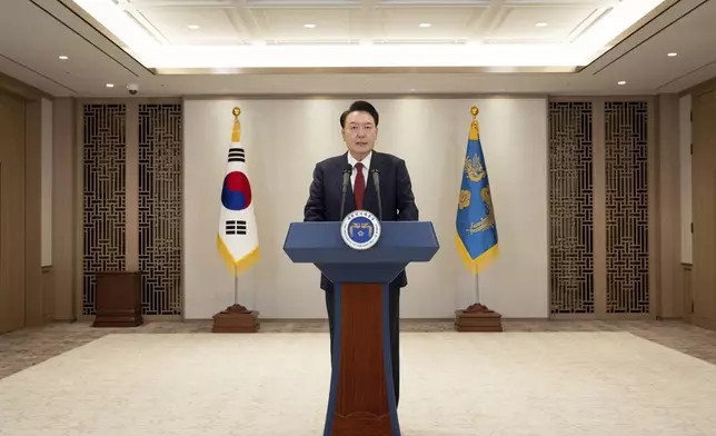 In this photo provided by South Korea Presidential Office, South Korean President Yoon Suk Yeol speaks at the presidential office in Seoul, South Korea, Thursday, Dec. 12, 2024. (South Korea Presidential Office via AP)