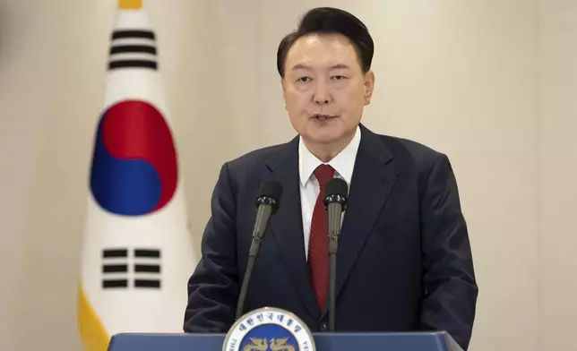 In this photo provided by South Korea Presidential Office, South Korean President Yoon Suk Yeol speaks at the presidential office in Seoul, South Korea, Thursday, Dec. 12, 2024. (South Korea Presidential Office via AP)