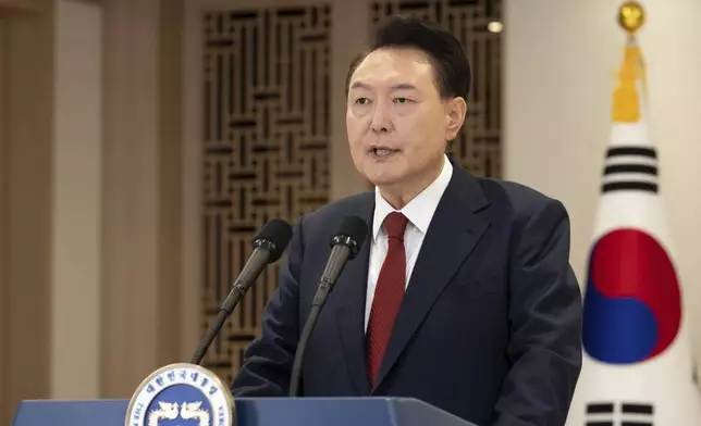 In this photo provided by South Korea Presidential Office, South Korean President Yoon Suk Yeol speaks at the presidential office in Seoul, South Korea, Thursday, Dec. 12, 2024. (South Korea Presidential Office via AP)