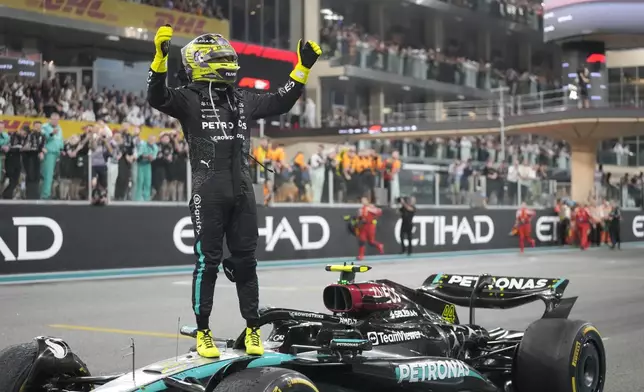 Lewis Hamilton of Britain reacts after his last race for the Mercedes team after the Formula One Abu Dhabi Grand Prix at the Yas Marina Circuit in Abu Dhabi, UAE, Sunday, Dec. 8, 2024. (AP Photo/Darko Bandic)