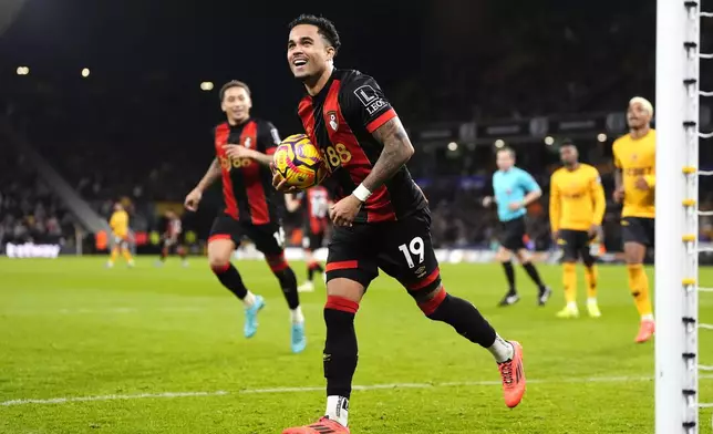 Bournemouth's Justin Kluivert celebrates scoring during the English Premier League soccer match at Molineux Stadium, Wolverhampton, England, Saturday Nov. 30, 2024. (Nick Potts/PA via AP)