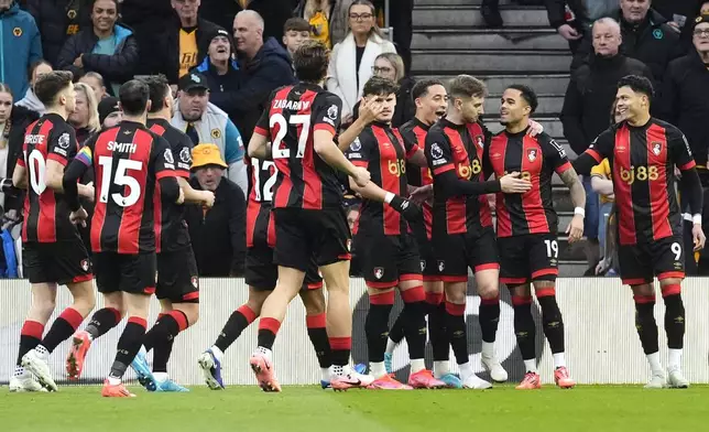 Bournemouth's Justin Kluivert, second right, celebrates scoring with teammates during the English Premier League soccer match at Molineux Stadium, Wolverhampton, England, Saturday Nov. 30, 2024. (Nick Potts/PA via AP)