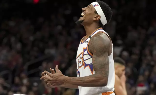 Phoenix Suns guard Bradley Beal reacts after scoring against the Denver Nuggets during the second half of an NBA basketball game, Wednesday, Dec. 25, 2024, in Phoenix. Phoenix won 110-100. (AP Photo/Rick Scuteri)