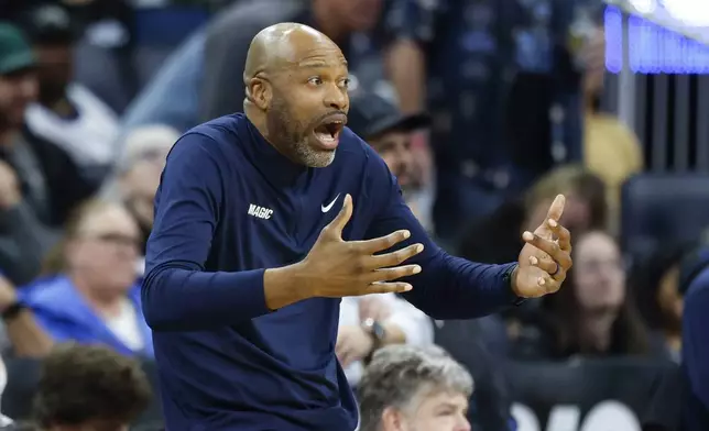 Orlando Magic head coach Jamahl Mosley reacts as his team plays the Miami Heat during the second half of an NBA basketball game, Thursday, Dec. 26, 2024, in Orlando, Fla. (AP Photo/Kevin Kolczynski)