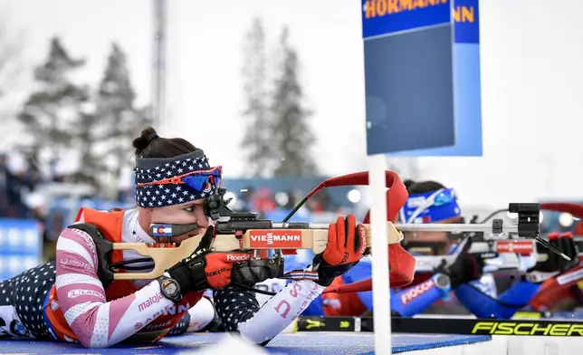 FILE - Joanne Reid, left, of the United States, shoots during the women's 4x6 km relay competition at the IBU World Biathlon Championships, in Ostersund, Sweden, March 16, 2019. (Jessica Gow/TT via AP, File)