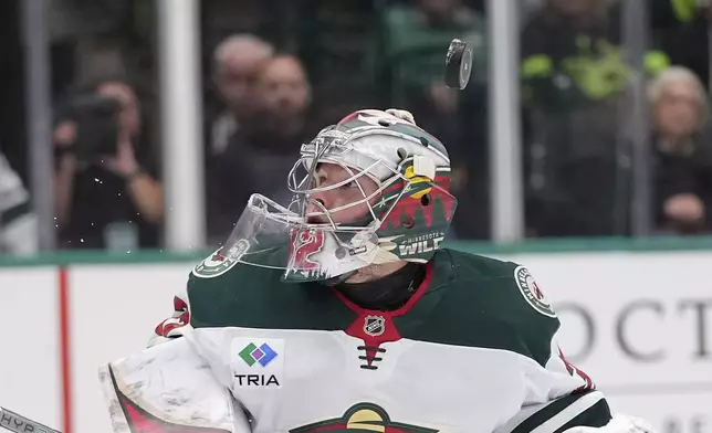 Minnesota Wild goaltender Filip Gustavsson defends the goal during the the first period of an NHL hockey game against the Dallas Stars Friday, Dec. 27, 2024, in Dallas. (AP Photo/LM Otero)