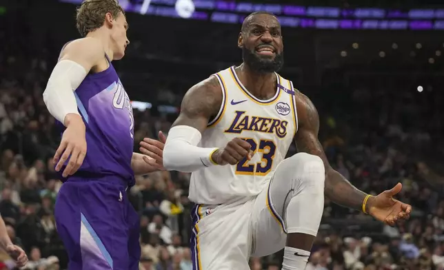 Los Angeles Lakers forward LeBron James, right, reacts after a call as Utah Jazz forward Lauri Markkanen, left, looks on during the first half of an NBA basketball game Sunday, Dec. 1, 2024, in Salt Lake City. (AP Photo/Bethany Baker)