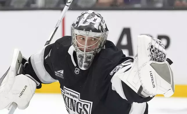 Los Angeles Kings goaltender Darcy Kuemper makes a glove save during the first period of an NHL hockey game against the Edmonton Oilers, Saturday, Dec. 28, 2024, in Los Angeles. (AP Photo/Mark J. Terrill)