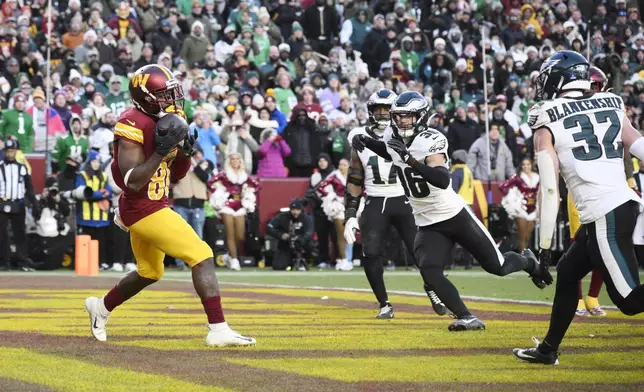 Washington Commanders wide receiver Jamison Crowder (80) makes a catch for a touchdown against the Philadelphia Eagles during the second half of an NFL football game, Sunday, Dec. 22, 2024, in Landover, Md. (AP Photo/Nick Wass)