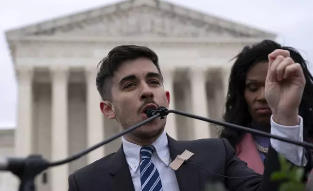 Attorney and transgender rights activist Chase Strangio speaks to supporters outside of the Supreme Court, Wednesday, Dec. 4, 2024, in Washington. (AP Photo/Jose Luis Magana)