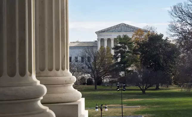 The Supreme Court is framed by the columns of the Capitol in Washington, Tuesday, Dec. 3, 2024. T (AP Photo/J. Scott Applewhite)