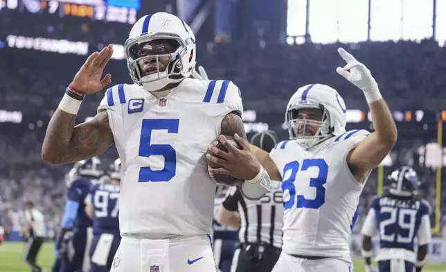 Indianapolis Colts quarterback Anthony Richardson (5) celebrates his touchdown during the first half of an NFL football game against the Tennessee Titans, Sunday, Dec. 22, 2024, in Indianapolis. (AP Photo/Michael Conroy)