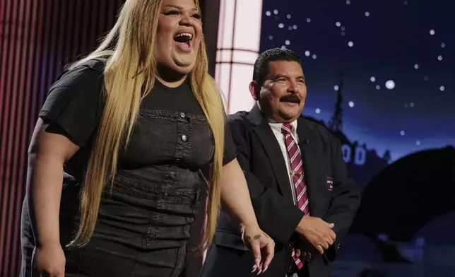 This image released by Disney shows TikTok creator Jools Lebron, left, with talk show personality Guillermo Rodriguez on the set of "Jimmy Kimmel Live!" on Monday, Aug. 19, 2024 in Los Angeles. (Randy Holmes/ABC-Disney via AP)