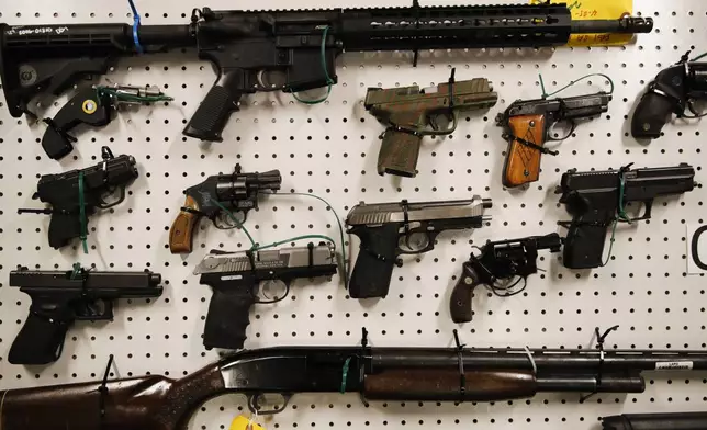 FILE - Seized firearms are displayed during a news conference Wednesday, Feb. 13, 2019, in Los Angeles. (AP Photo/Jae C. Hong, File)