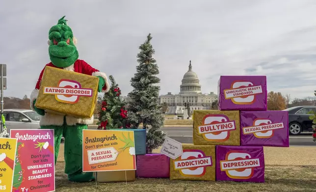 FILE - In advance of Instagram CEO Adam Mosseri's Congressional testimony, to illustrate the harms children face on social media, parent activists brought an "Instagrinch" to the Capitol building in Washington, Dec. 7, 2021. (Eric Kayne/AP Images for ParentsTogether, File)