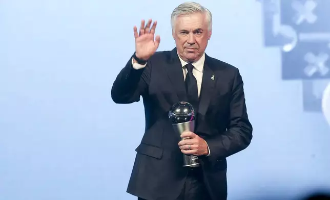 Carlo Ancelotti, Head Coach of Real Madrid, receives the Best FIFA Men's Coach Award during the FIFA Football Awards 2024 in Doha, Qatar, Tuesday, Dec. 17, 2024. (AP Photo/Hussein Sayed)