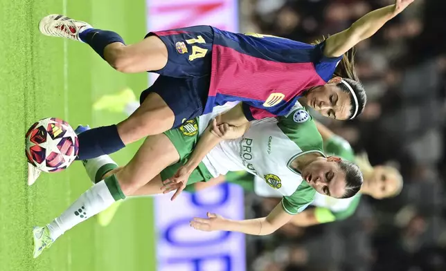 Barcelona's Aitana Bonmatí, left, and Hammarby's Smilla Vallotto in action during the Champions League group D women's soccer match between Hammarby IF and FC Barcelona at Stockholm Arena in Stockholm, Sweden, Thursday Dec. 12, 2024. (Jonas Ekströmer/TT via AP)