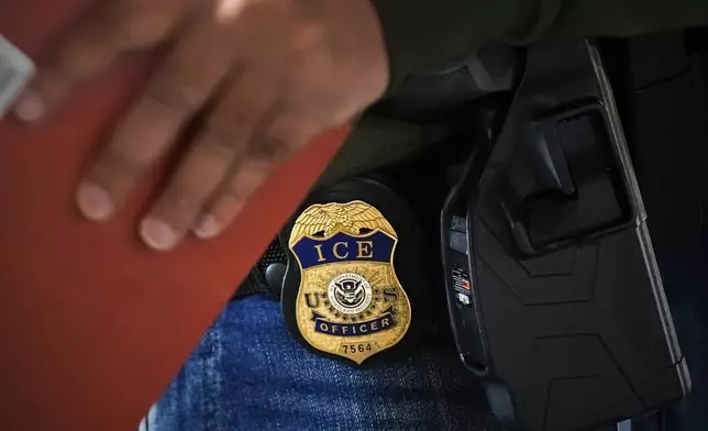 A deportation officer with Enforcement and Removal Operations in U.S. Immigration and Customs Enforcement's New York City field office conducts a brief before an early morning operation, Tuesday, Dec. 17, 2024, in the Bronx borough of New York. (AP Photo/Julia Demaree Nikhinson)