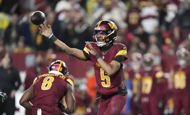 Washington Commanders quarterback Jayden Daniels (5) passes during the second half of an NFL football game, against the Atlanta Falcons Sunday, Dec. 29, 2024, in Landover, Md. (AP Photo/Stephanie Scarbrough)