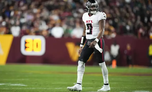 Atlanta Falcons quarterback Michael Penix Jr. (9) reacts during the second half of an NFL football game against the Washington Commanders, Sunday, Dec. 29, 2024, in Landover, Md. (AP Photo/Stephanie Scarbrough)