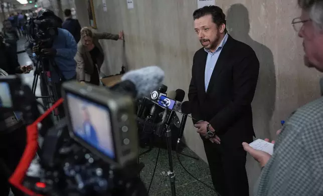 Timothy Oliver Lee, second from right, brother of Cash App founder Bob Lee, speaks to reporters after exiting the courtroom at the Hall of Justice for the murder trial of Nima Momeni, Tuesday, Dec. 3, 2024, in San Francisco. (AP Photo/Godofredo A. Vásquez)