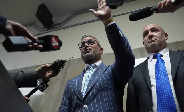 Defense attorneys Saam Zangeneh, center, and Bradford Cohen, right, speak to reporters after exiting the courtroom at the Hall of Justice for the murder trial of Nima Momeni, Tuesday, Dec. 3, 2024, in San Francisco. (AP Photo/Godofredo A. Vásquez)