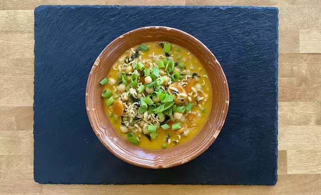 This image shows a recipe for khao soi Thai soup from “You Gotta Eat,” by Margaret Reby, in Barcelona, Spain on Dec. 16, 2024. (Albert Stumm via AP)