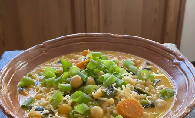 This image shows a recipe for khao soi Thai soup from “You Gotta Eat,” by Margaret Reby, in Barcelona, Spain on Dec. 16, 2024. (Albert Stumm via AP)