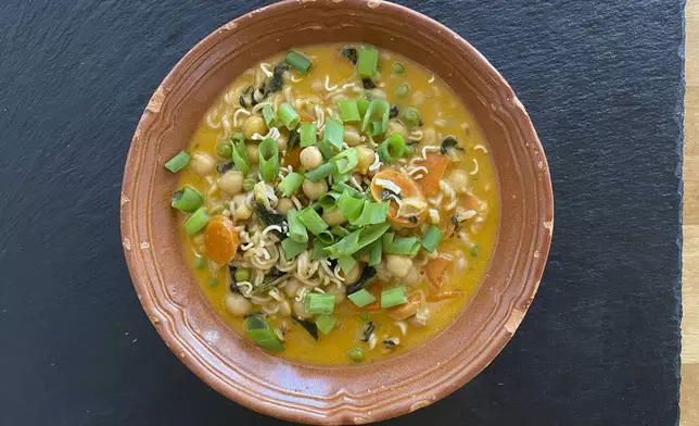 This image shows a recipe for khao soi Thai soup from “You Gotta Eat,” by Margaret Reby, in Barcelona, Spain on Dec. 16, 2024. (Albert Stumm via AP)