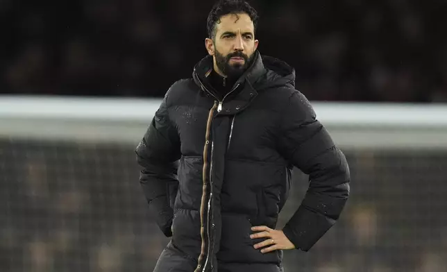 Manchester United's head coach Ruben Amorim looks on at the end of the English Premier League soccer match between Arsenal and Manchester United at Emirates stadium in London, Wednesday, Dec. 4, 2024. (AP Photo/Kirsty Wigglesworth)