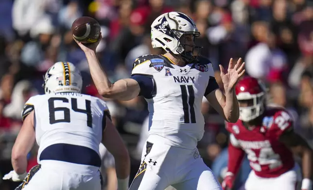 Navy quarterback Blake Horvath throws a pass against Oklahoma during the first half of the Armed Forces Bowl NCAA college football game, Friday, Dec. 27, 2024, in Fort Worth, Texas. (AP Photo/Julio Cortez)