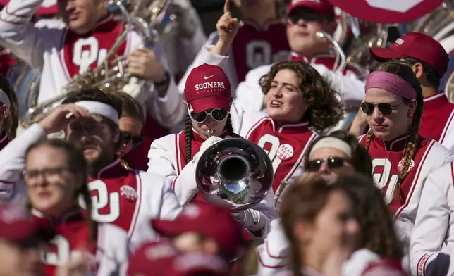 A member of the Oklahoma band tunes an instrument prior to the Armed Forces Bowl NCAA college football game between Navy and Oklahoma, Friday, Dec. 27, 2024, in Fort Worth, Texas. (AP Photo/Julio Cortez)