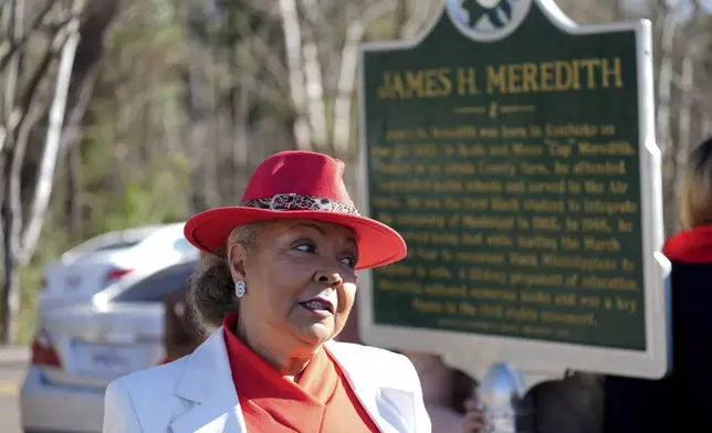 Judy Alsobrooks Meredith, wife of James Meredith, who became the first Black student to enroll at the University of Mississippi in 1962, stands before a Mississippi Department of Archives and History marker recognizing his birthplace and his legacy in Kosciusko, Miss., Friday, Dec. 20, 2024. (AP Photo/Rogelio V. Solis)