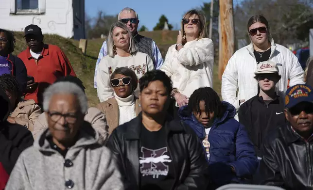 A crowd watch the unveiling of a Mississippi Department of Archives and History marker recognizing the birthplace and legacy of James Meredith, who became the first Black student to enroll at the University of Mississippi in 1962, Friday, Dec. 20, 2024, in Kosciusko, Miss. (AP Photo/Rogelio V. Solis)