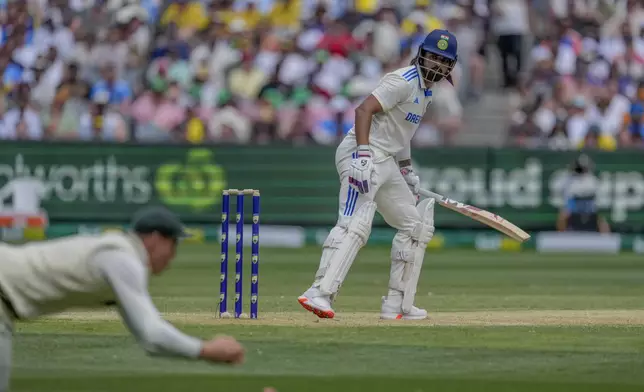 India's KL Rahul looks back after edging a ball to Australia's Marnus Labuschagne during play on the second day of the fourth cricket test between Australia and India at the Melbourne Cricket Ground, Melbourne, Australia, Friday, Dec. 27, 2024. (AP Photo/Asanka Brendon Ratnayake)