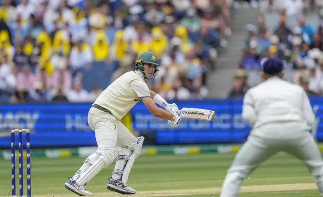 Australia's captain Pat Cummins bats during play on the second day of the fourth cricket test between Australia and India at the Melbourne Cricket Ground, Melbourne, Australia, Friday, Dec. 27, 2024. (AP Photo/Asanka Brendon Ratnayake)