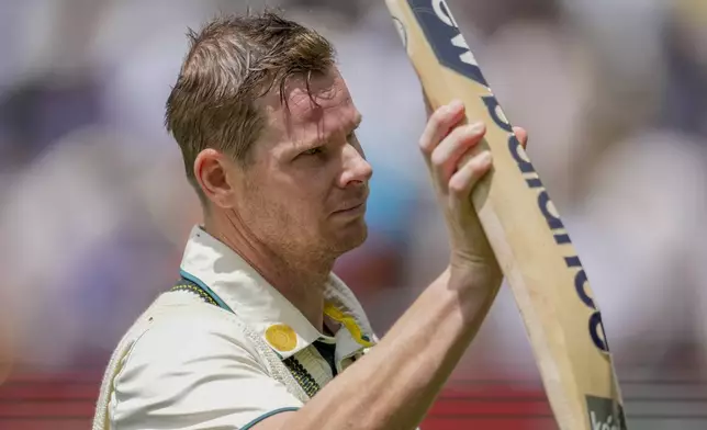 Australia's Steve Smith acknowledged the crowd as he walked off the field during the lunch break on the second day of the fourth cricket test between Australia and India at the Melbourne Cricket Ground, Melbourne, Australia, Friday, Dec. 27, 2024. (AP Photo/Asanka Brendon Ratnayake)