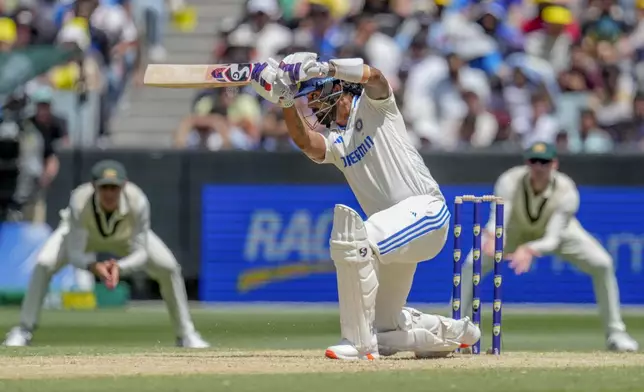 India's KL Rahul hits a boundary during play on the second day of the fourth cricket test between Australia and India at the Melbourne Cricket Ground, Melbourne, Australia, Friday, Dec. 27, 2024. (AP Photo/Asanka Brendon Ratnayake)