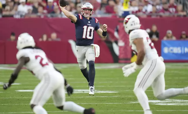 New England Patriots quarterback Drake Maye (10) throws against the Arizona Cardinals during the second half of an NFL football game, Sunday, Dec. 15, 2024, in Glendale, Ariz. (AP Photo/Ross D. Franklin)