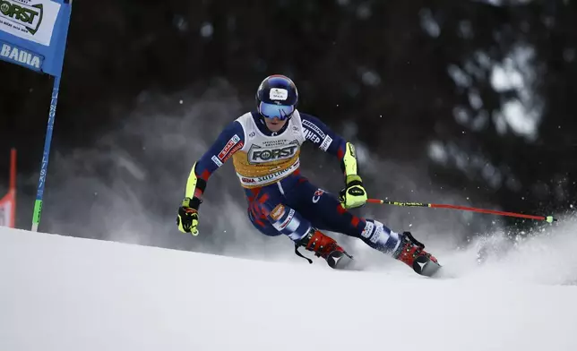 Croatia's Filip Zubcic speeds down the course during an alpine ski, men's World Cup giant slalom, in Alta Badia, Italy, Sunday, Dec. 22, 2024. (AP Photo/Gabriele Facciotti)