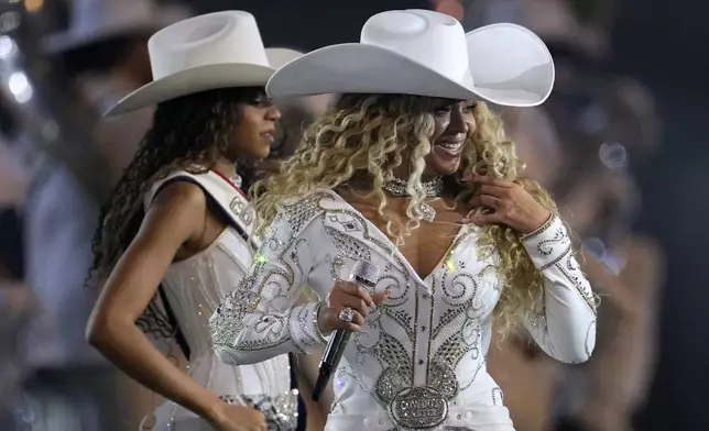 Beyoncé performs during halftime of an NFL football game between the Houston Texans and the Baltimore Ravens, Wednesday, Dec. 25, 2024, in Houston. (AP Photo/David J. Phillip)