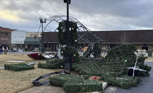 Damage from a storm through that rolled through the night before is seen at the heart of downtown on Sunday, Dec. 29, 2024, in Athens, Ala. (AP Photo/Lance George)