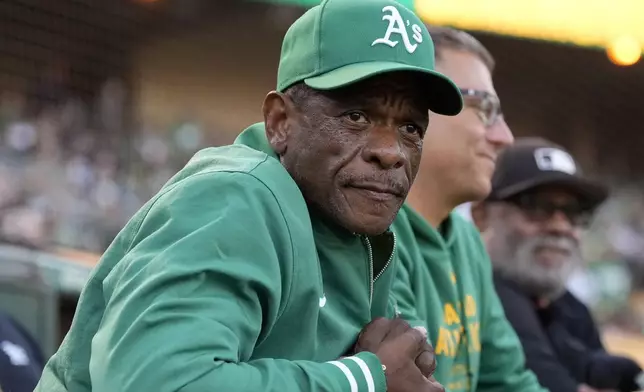 FILE - Former Oakland Athletics player Rickey Henderson looks on before a baseball game between the Athletics and the Texas Rangers in Oakland, Calif., Sept. 25, 2024. (AP Photo/Jeff Chiu, File)